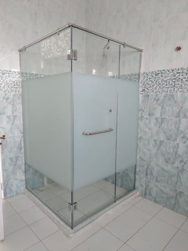 Transform your corner into a luxury shower zone. Sleek, frameless square cubicle with premium tempered glass. Expertly installed by Shower Door.